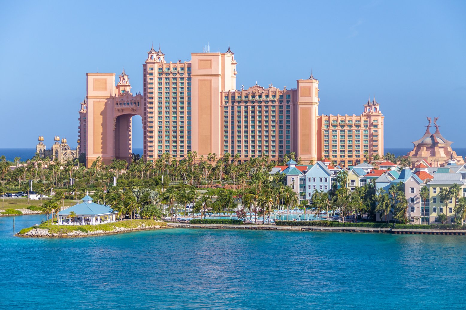 City Building Near Body of Water under Blue Sky